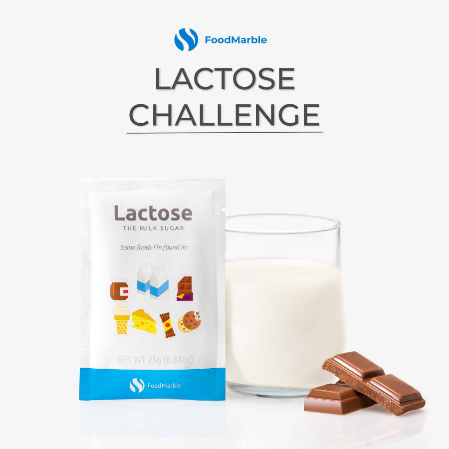 FoodMarble Lactose sachet with glass of milk and chocolate on white background