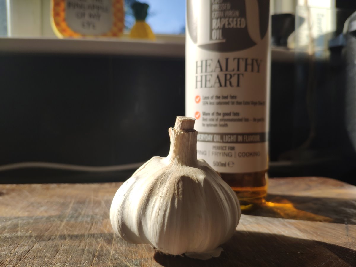 Close up of garlic bulb and oil