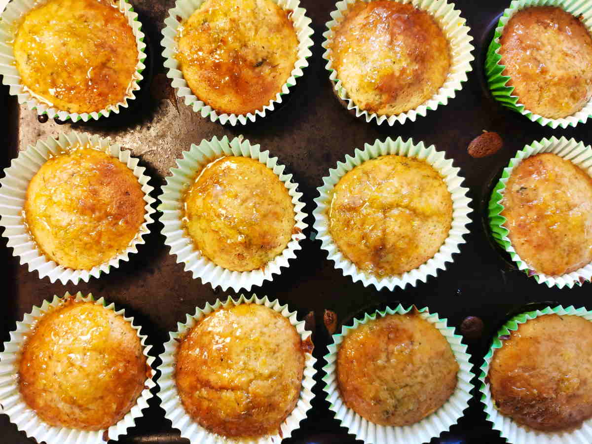 Glazed citrus corgette cupcakes in baking tin